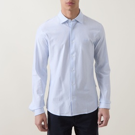 Model wearing Hugo Boss Orange Mysoft Stripe Shirt in Open Blue, with spread collar, long sleeves and single cuff, styled with navy trousers