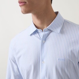 Model wearing Hugo Boss Orange Mysoft Stripe Shirt in Open Blue, showing spread collar and logo detail on chest