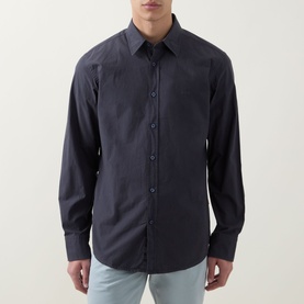 Model wearing Hugo Boss Orange Relegant Logo Casual Shirt in dark blue, long sleeves, front button placket, styled with light blue jeans