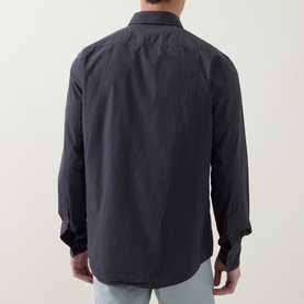 Model wearing Hugo Boss Orange Relegant Logo Casual Shirt in dark blue, rear view, long sleeves, paired with light blue jeans