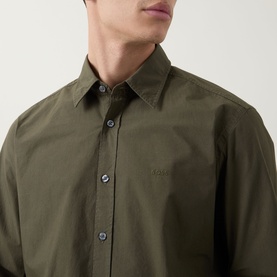 Model wearing Hugo Boss Orange bright green cotton casual shirt with tonal button placket and subtle chest logo embroidery