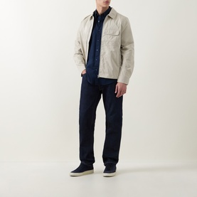 Model wearing Hugo Boss Orange Ricoplus Dark Blue casual shirt, styled with stone overshirt and navy trousers.