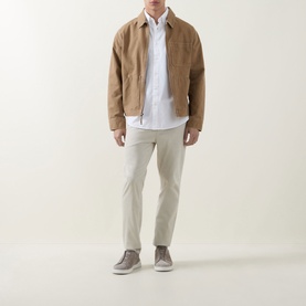 Model wearing Hugo Boss Orange Ricoplus White Casual Shirt with button-down collar, styled with a tan suede jacket and light grey trousers.