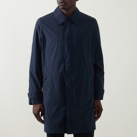 Model wearing Hugo Boss Clark Water Repellent Coat in dark blue with pointed collar and concealed snap button placket.