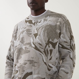 Model wearing Hugo Boss Orange Afloralo Jacquard Relaxed Fit Sweater in light beige with abstract floral jacquard pattern and ribbed crew neck