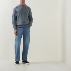 Model wearing Hugo Boss Orange Arkingo Texture Rib Sweater in Open Grey with blue jeans and navy trainers