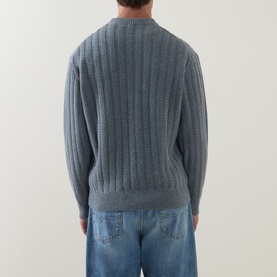 Model wearing Hugo Boss Orange Arkingo Texture Rib Sweater in Open Grey, ribbed vertical knit, crew neck, back view, styled with blue jeans