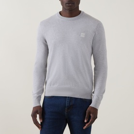 Model wearing Hugo Boss Orange Kanovano Logo Regular Fit Sweater in Open Grey, crew neck with logo patch, styled with dark blue jeans