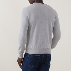 Model wearing Hugo Boss Orange Kanovano Logo Regular Fit Sweater in Open Grey, crew neck, ribbed trims, styled with dark blue jeans. Rear view.
