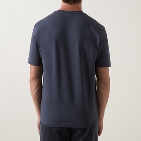 Model wearing Hugo Boss Orange T Chup Logo T-Shirt in dark blue, crew neck, short sleeves, rear view showing straight hem and tonal stitching