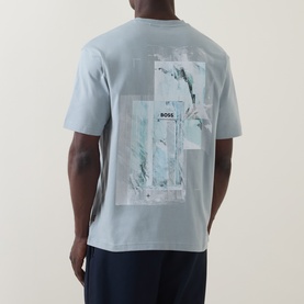 Model wearing Hugo Boss Orange Te Frame Logo Back Graphic T-Shirt in Open Grey, showing back print with abstract graphic and logo detail.