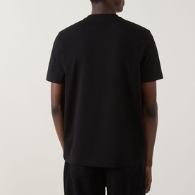 Model wearing Hugo Boss Orange Te Logo T-Shirt in black, rear view, crew neck, short sleeves, straight hem, smooth cotton finish.
