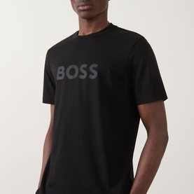 Model wearing Hugo Boss Orange Te Logo T-Shirt in black, featuring tonal BOSS chest logo, crew neck and short sleeves.