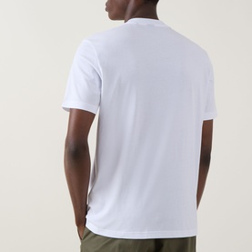 Model wearing Hugo Boss Orange Te Logo T-Shirt in white, rear view showing crew neck, short sleeves, and straight hem in smooth cotton finish.