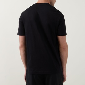 Model wearing Hugo Boss Orange black crew neck cotton T-shirt, rear view showing clean back seam and short sleeves.