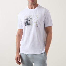 Model wearing Hugo Boss Orange Te Motors Logo Graphic T-Shirt in white, featuring a chest motor graphic print, crew neck and short sleeves.
