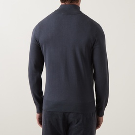 Model wearing Hugo Boss Orange Kanobix Half-Zip Sweater in dark blue, back view, showing fine-knit finish and ribbed trims, styled with matching