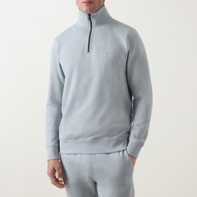 Model wearing Hugo Boss Orange Zetrust Half-Zip Sweatshirt in Open Grey with matching joggers. Funnel neck, tonal chest logo badge.