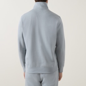 Model wearing Hugo Boss Orange Zetrust Half-Zip Sweatshirt in Open Grey, rear view, with matching grey joggers