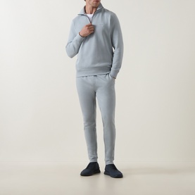 Model wearing Hugo Boss Orange Zetrust Half-Zip Sweatshirt in Open Grey, styled with matching grey joggers and navy shoes