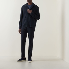 Model wearing Hugo Boss Carper Stripe Overshirt in dark blue with navy trousers and blue suede trainers