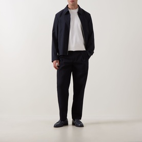 Model wearing Hugo Boss dark blue wool zip-up jacket with white T-shirt, black trousers and dark leather shoes.