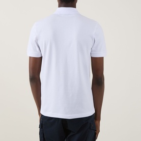 Model wearing Hugo Boss Orange Passertip Logo Polo Shirt in White, rear view, with navy trousers visible at hem.