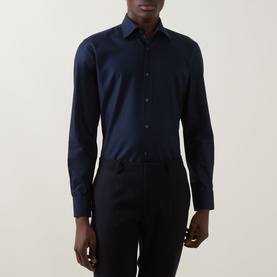 Model wearing Hugo Boss Hank K Single-Cuff Shirt in dark blue with spread collar, long sleeves and sateen finish, styled with black trousers