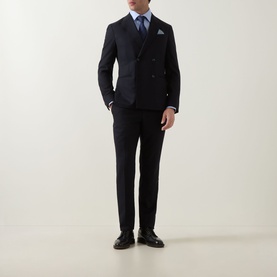 Model wearing Hugo Boss Light Blue Single Cuff Slim shirt, styled with navy double-breasted suit, pocket square, and black leather shoes.