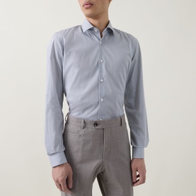 Model wearing Hugo Boss dark blue single cuff slim formal shirt with white contrast collar, styled with grey tailored trousers.