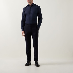 Model wearing Hugo Boss dark blue single cuff regular fit shirt with matching navy trousers and black leather shoes.