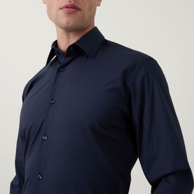 Model wearing Hugo Boss dark blue single cuff regular fit formal shirt, slim collar, long sleeves with button cuffs visible