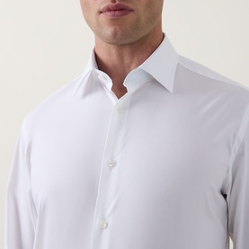 Model wearing Hugo Boss Joe Classic Shirt in white, showing Kent collar and front placket button fastening in a close-up torso shot.