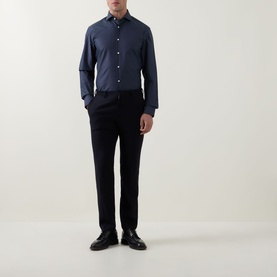 Model wearing Hugo Boss Dark Blue single cuff regular fit cotton formal shirt, styled with navy trousers and black leather shoes.