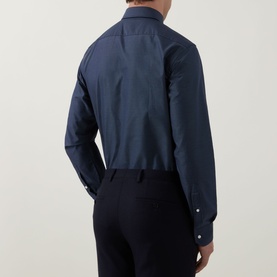 Model wearing Hugo Boss dark blue single cuff regular cotton formal shirt, rear view, styled with navy trousers