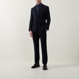 Model wearing Hugo Boss Dark Blue Single Cuff Regular shirt styled with a navy suit and black lace-up shoes.