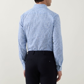 Model wearing Hugo Boss light blue floral print slim fit formal shirt, back view, styled with navy trousers