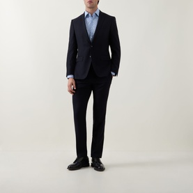 Model wearing Hugo Boss Light Blue Single Cuff Slim shirt, styled with a navy suit and black leather shoes.