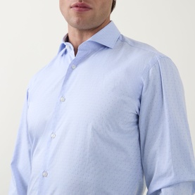 Model wearing Hugo Boss light blue cotton formal shirt with spread collar and single cuff, subtle texture detail visible