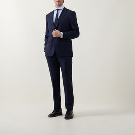 Model wearing Hugo Boss Light Blue Single Cuff Regular shirt, styled with navy suit and black leather shoes.