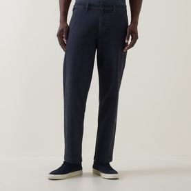 Model wearing Hugo Boss Orange dark blue straight-fit jeans in cotton-elastane, styled with blue suede loafers