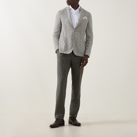 Model wearing Hugo Boss Hanry Houndstooth Single-Breasted Blazer in Open Green, styled with olive trousers and white shirt