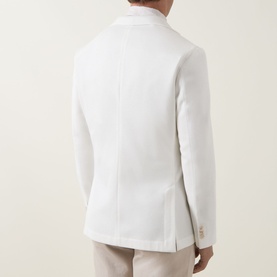 Model wearing Hugo Boss Hanry Single-Breasted Suit Jacket in Open White, rear view showing double vent and buttoned cuffs