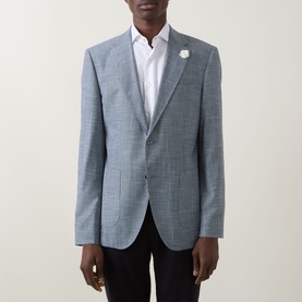 Model wearing Hugo Boss Janson Single-Breasted Suit Jacket in dark blue tonal check, styled with white shirt and floral lapel pin, black trousers