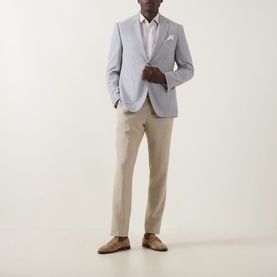 Model wearing Hugo Boss Open Grey cotton-wool suit jacket, styled with white shirt, stone chinos and tan suede loafers