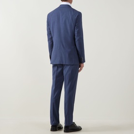 Model wearing Hugo Boss Jeckson Single-Breasted Two-Piece Suit in light blue, rear view, styled with white shirt and black loafers.