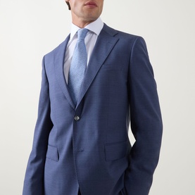Model wearing Hugo Boss Jeckson Single-Breasted Two-Piece Suit in light pastel blue, styled with a white shirt and light blue tie.