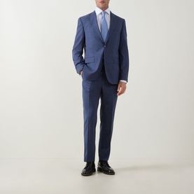 Model wearing Hugo Boss Jeckson Single-Breasted Two-Piece Suit in light blue, styled with white shirt, blue tie and black dress shoes