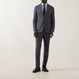Model wearing Hugo Boss Huge Two-Piece Suit in light blue wool, styled with white shirt, navy tie and black leather shoes