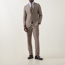 Model wearing Hugo Boss Huge Single-Breasted Two-Piece Suit in dark beige wool, styled with white shirt and grey tie, black oxford shoes.